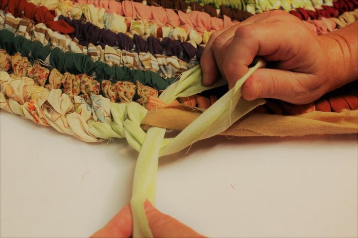 a person cutting up some type of fabric