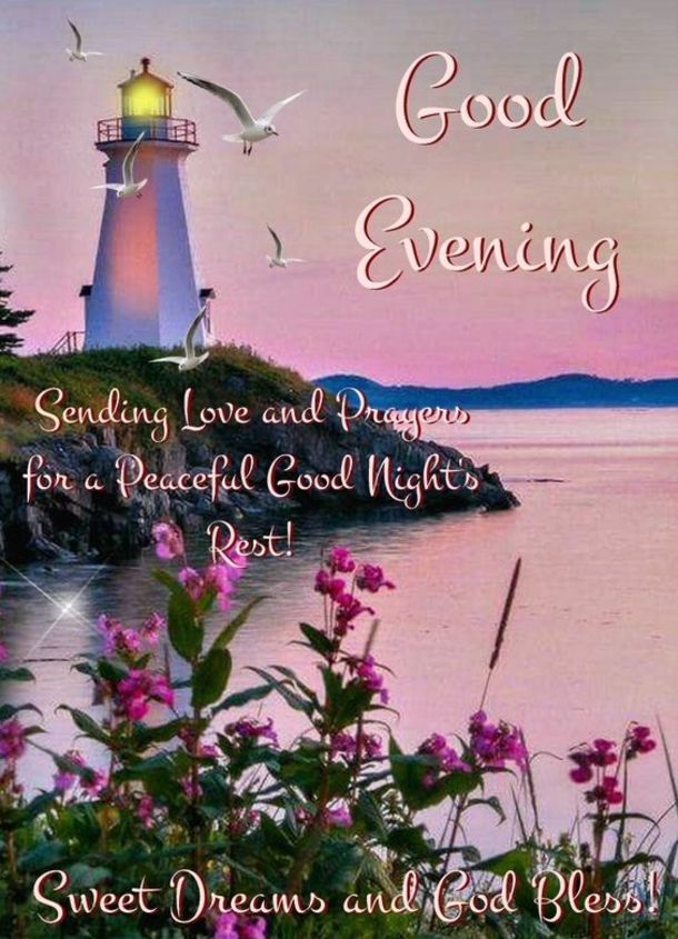 a lighthouse with the words good evening on it and some flowers in front of it