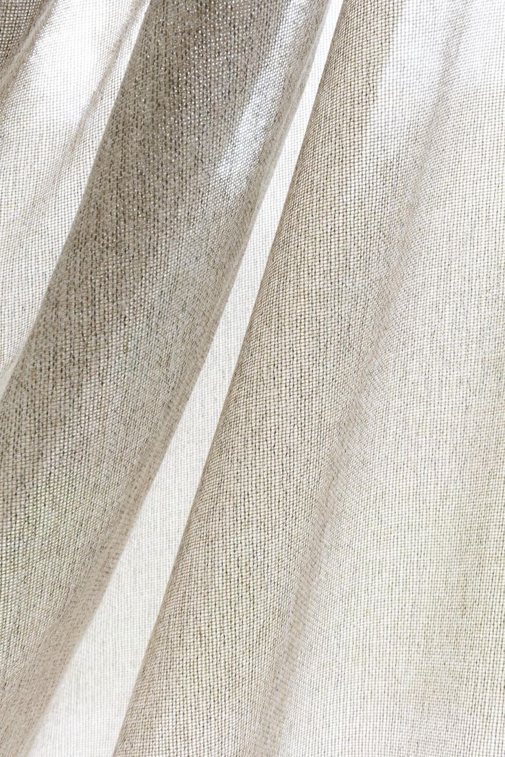 a close up view of a white curtain