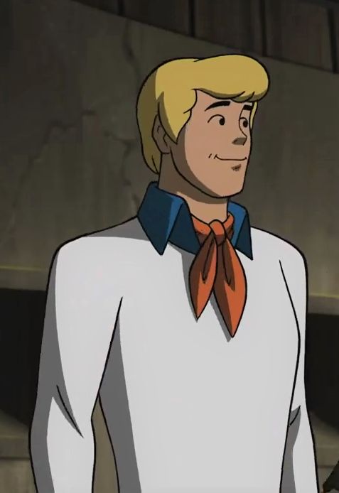 an animated man with blonde hair wearing a white shirt and orange tie