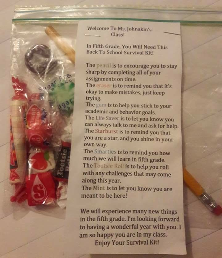 a candy bag with some writing on it and two pencils next to the package