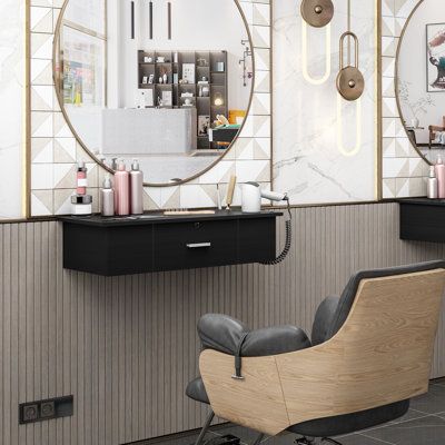 a hair salon with two mirrors on the wall and chairs in front of each other