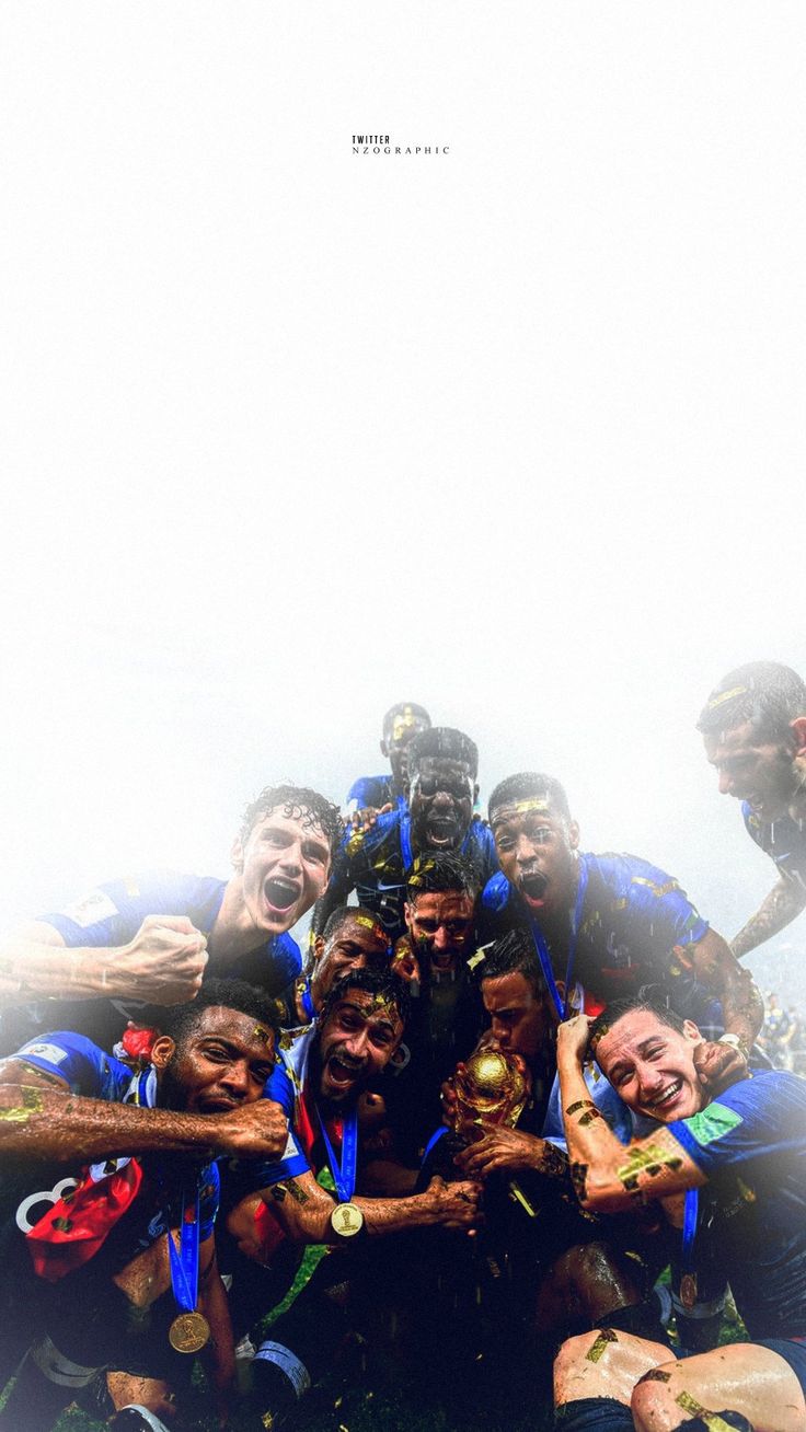 a group of men standing next to each other holding up trophies in front of them