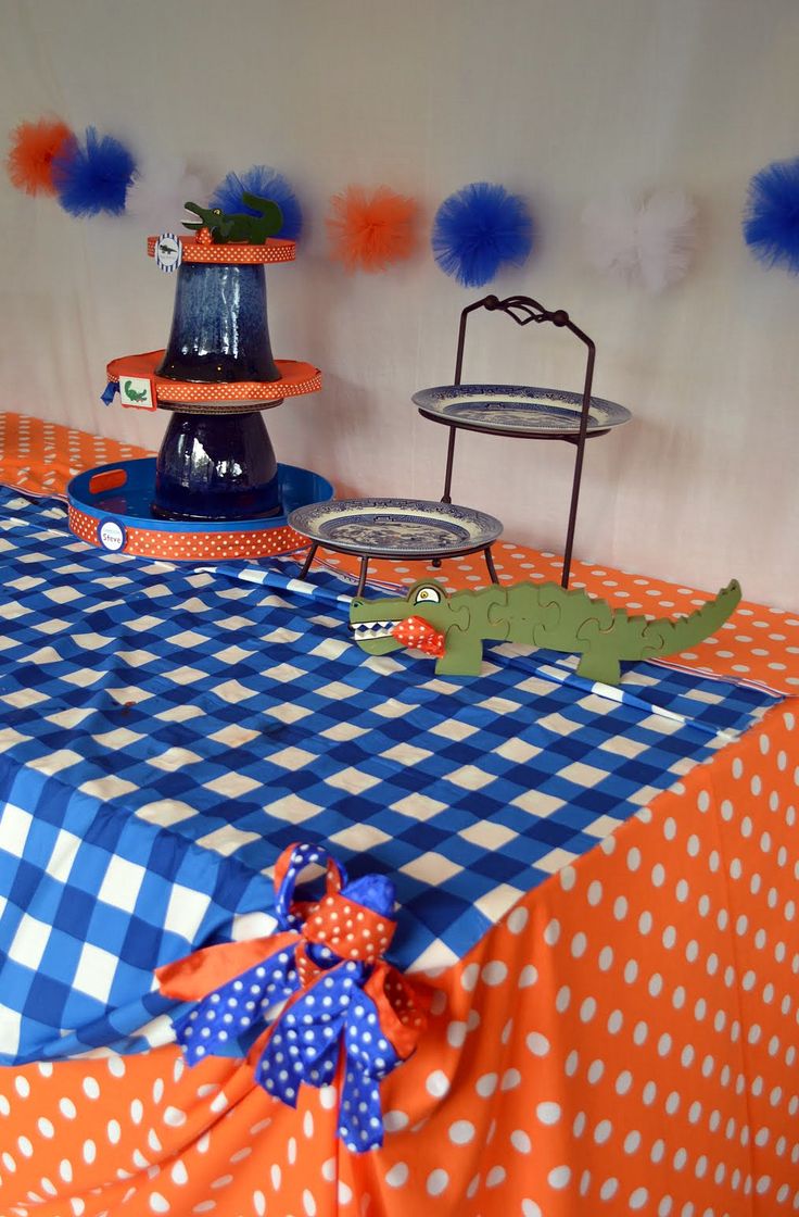 an orange and blue table cloth with polka dots