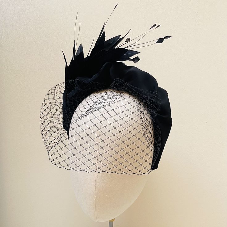 FABRIC This Women's fascinator headband is carefully hand made from pure silk. This is not a just a feather stuck on a synthetic covered headband like many on the market. The silk drapes beautifully on this padded band with a beautiful complementary Coque feather mount which is carefully stitched within the headband for a flawless finish. The head crown is light, soft and super comfortable and boasts a quality finish with no glued parts to ensure a luxurious, sustainable and top quality finish. Elegant Evening Veil With Headband, Gatsby Style Evening Fascinator Headband, Elegant Evening Headpieces With Ostrich Feathers, Evening Gatsby Style Fascinator Headband, Elegant Ostrich Feather Headpieces For Races, Elegant Fitted Ostrich Feather Headpieces, Elegant Feathered Evening Headband, Evening Fascinator With Feather Trim, Elegant Party Headband With Feather Trim