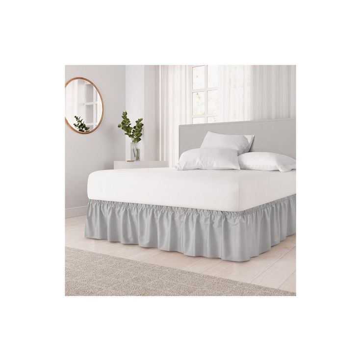 the bed is made with white sheets and beige ruffled bedskirt, along with a round mirror