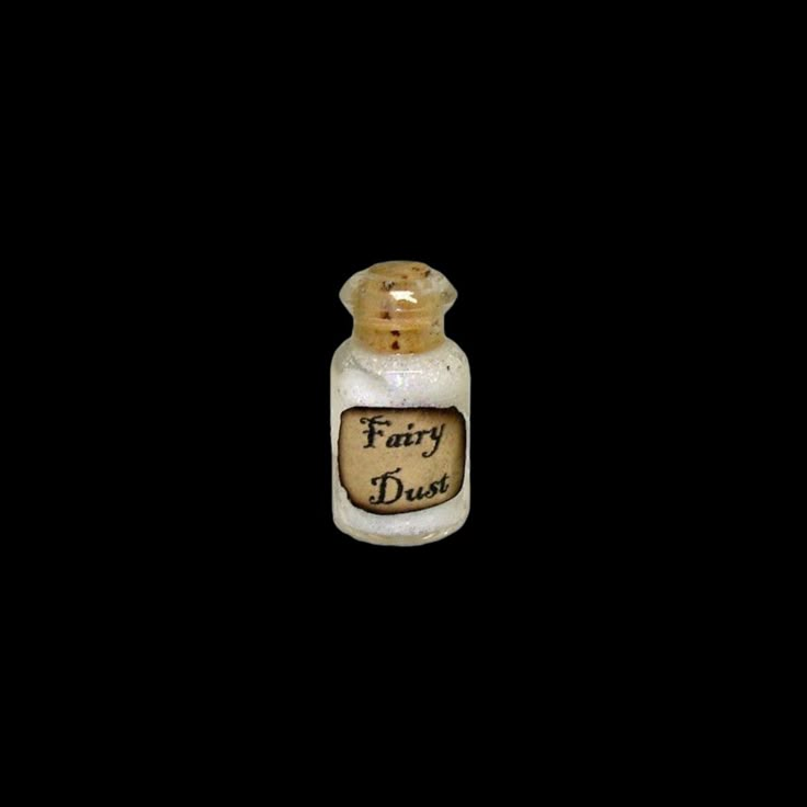 a small bottle with the word fairy dust written on it