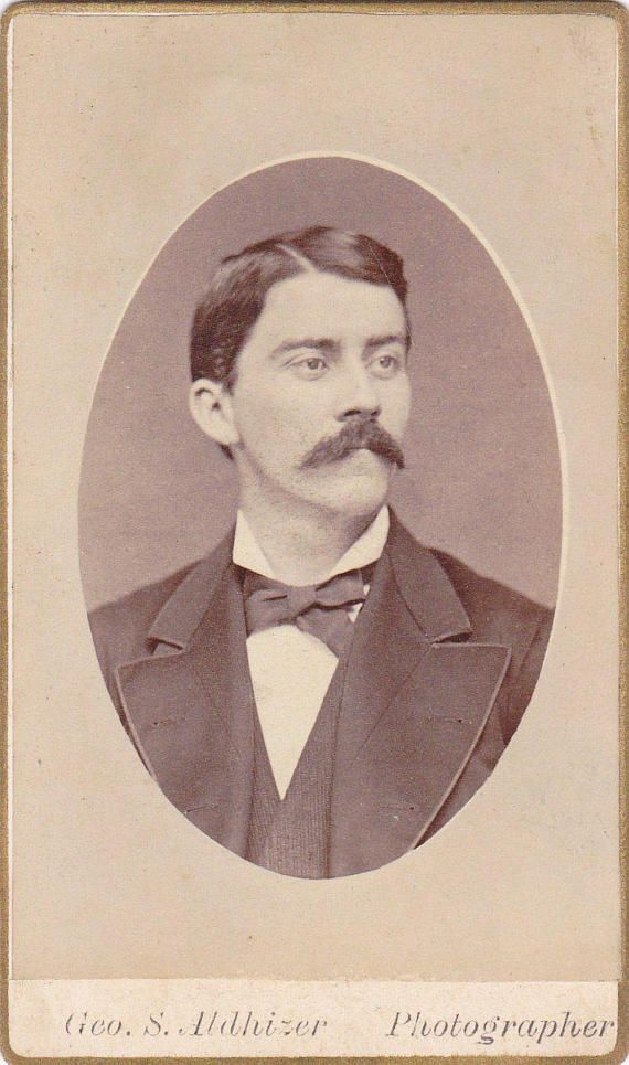 an old photo of a man with a mustache