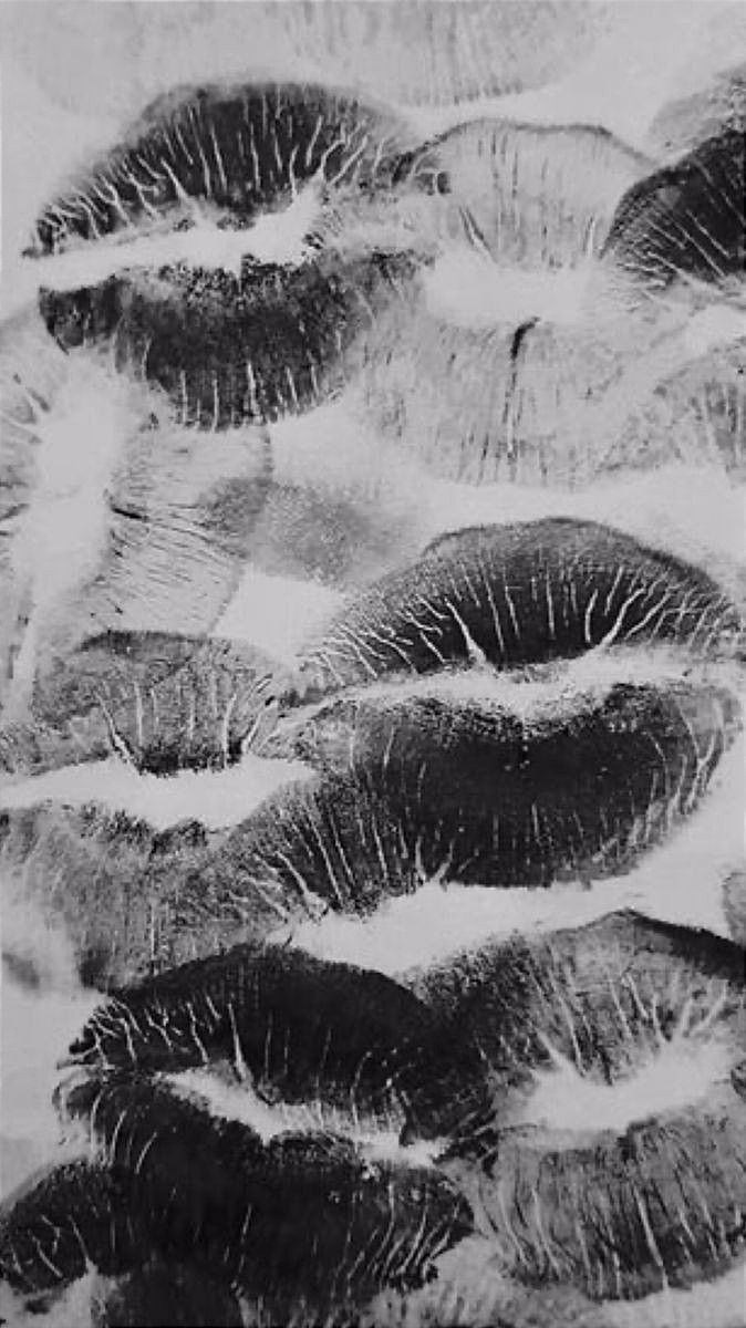 black and white photograph of water droplets floating on the surface, creating an abstract pattern