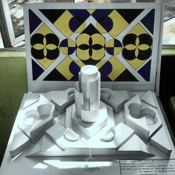 an architectural model on display in front of a window