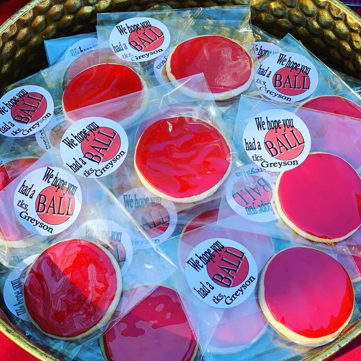 red and white decorated cookies in plastic bags