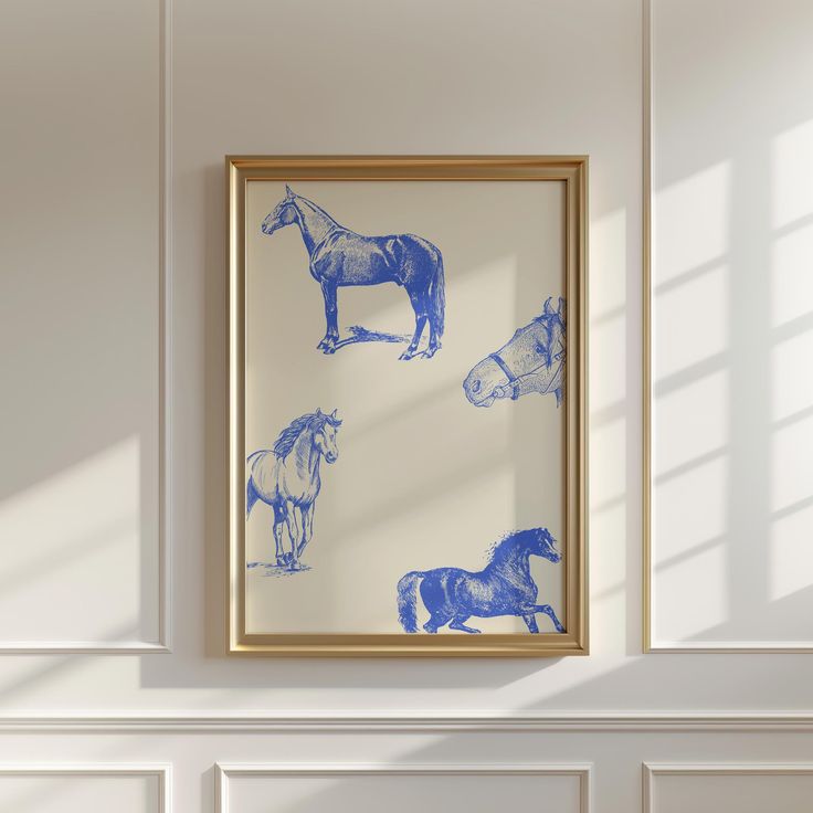 a blue and white horse print hangs on the wall