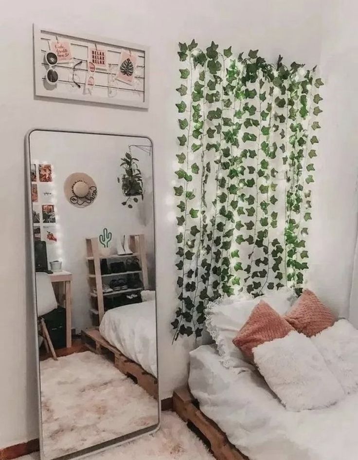 a bedroom with a bed, mirror and plants on the wall