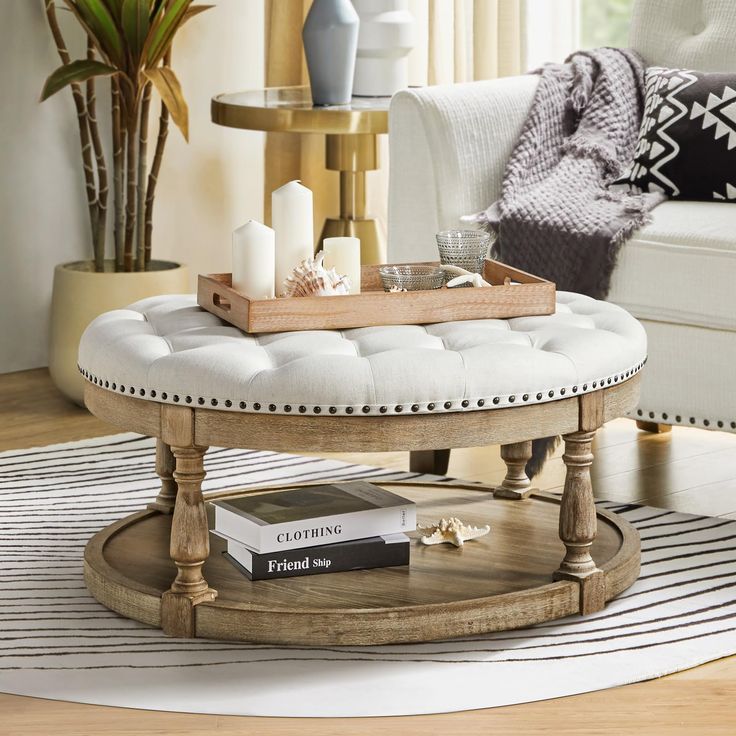 a coffee table with a tray on top of it in front of a white couch