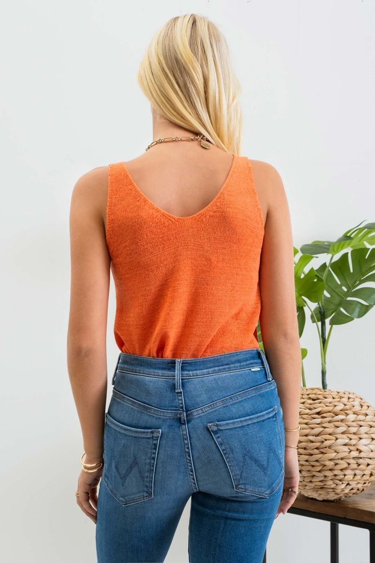 Our Lightweight Sweater Tank is the perfect staple piece for your wardrobe, providing a lightweight and versatile option for both summer and year-round wear. Also available in other colors. Lightweight, knit tank top Fits true to size 55% acrylic, 45% nylon Machine wash gentle cycle, hang dry Orange V-neck Knit Top, Stretch Textured Knit Sweater Vest For Spring, Summer Textured Knit Tank Top For Layering, Casual Fitted Textured Knit Vest, Fitted Soft Knit Sweater Vest For Spring, Knit V-neck Tank Top For Day Out, Spring Textured Knit Stretch Tank Top, Casual Tank Knit Top For Day Out, Spring Stretch Textured Knit Tank Top