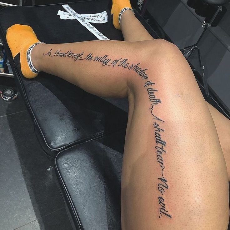 a woman with a tattoo on her leg