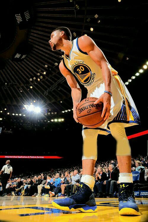 a basketball player standing on top of a court with a ball in it's hand