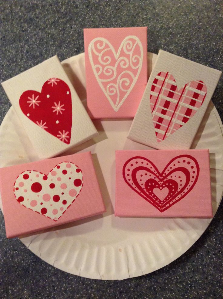 paper plates with hearts on them sitting on a table