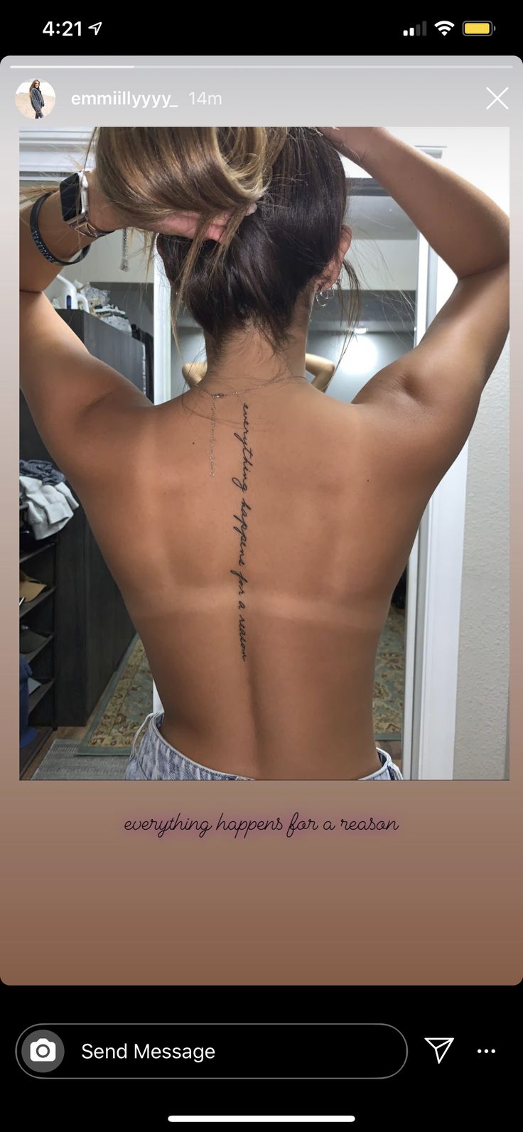 the back of a woman's body with writing on it