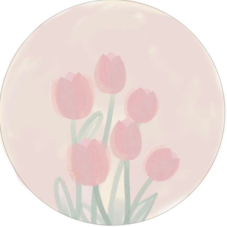 pink tulips are on a light pink plate