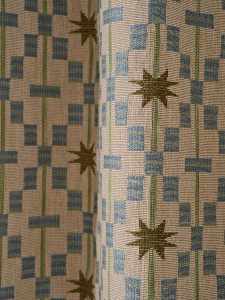 a curtain with stars on it in front of a window