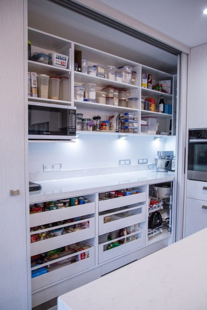 an open pantry with lots of food in it