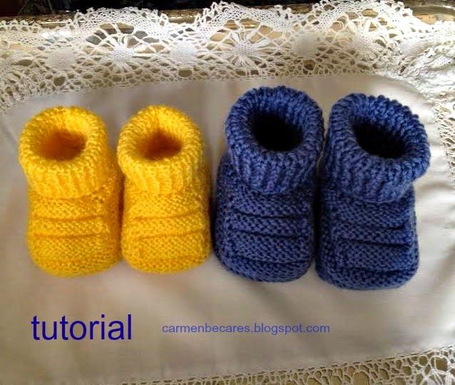 three knitted baby booties sitting next to each other