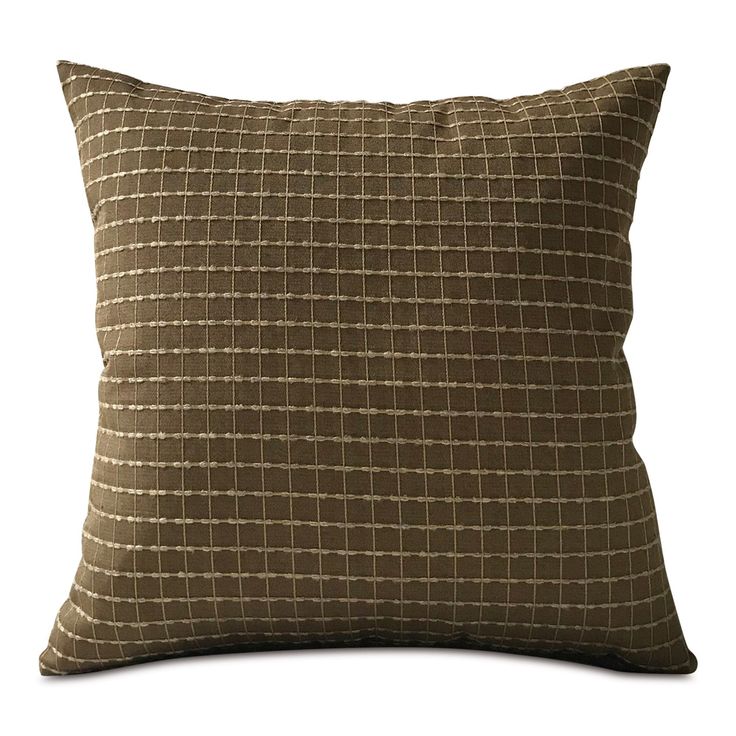 a brown and white checkered pillow on a white background