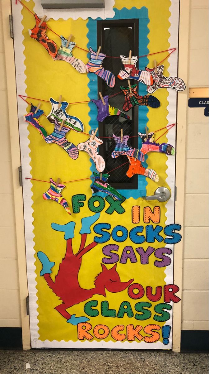 a door decorated with an image of rock'n'roll and the words for i'm rocks says our class rocks