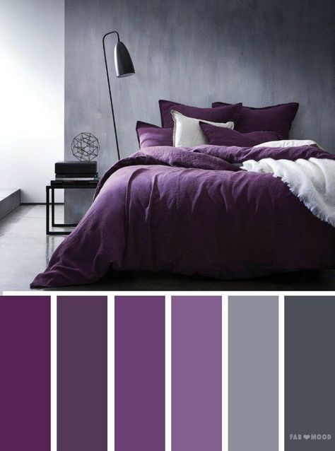 a bedroom with purple and grey colors in it