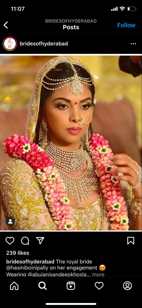 a woman in a bridal gown with flowers on her head and necklaces around her neck