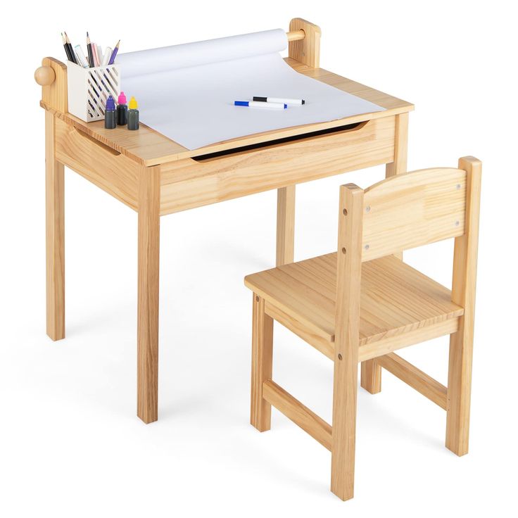 a wooden table with two chairs and a white board on top of it that has writing utensils in front of it