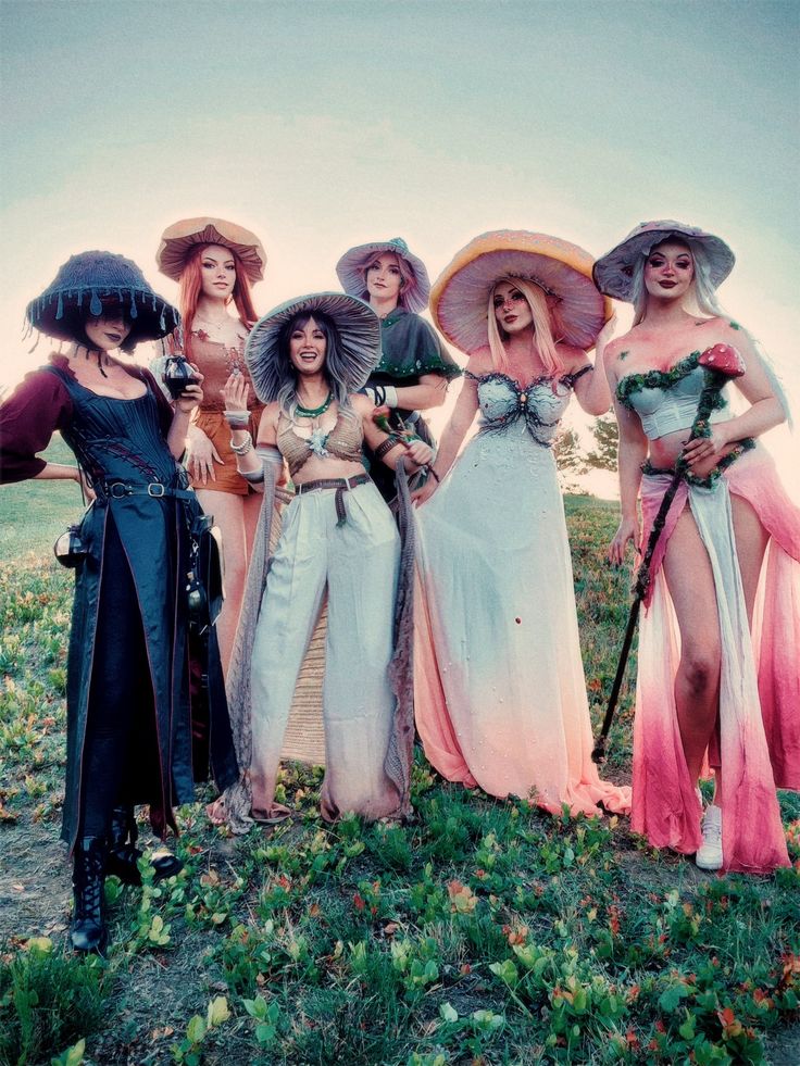 four women dressed in costume posing for a photo