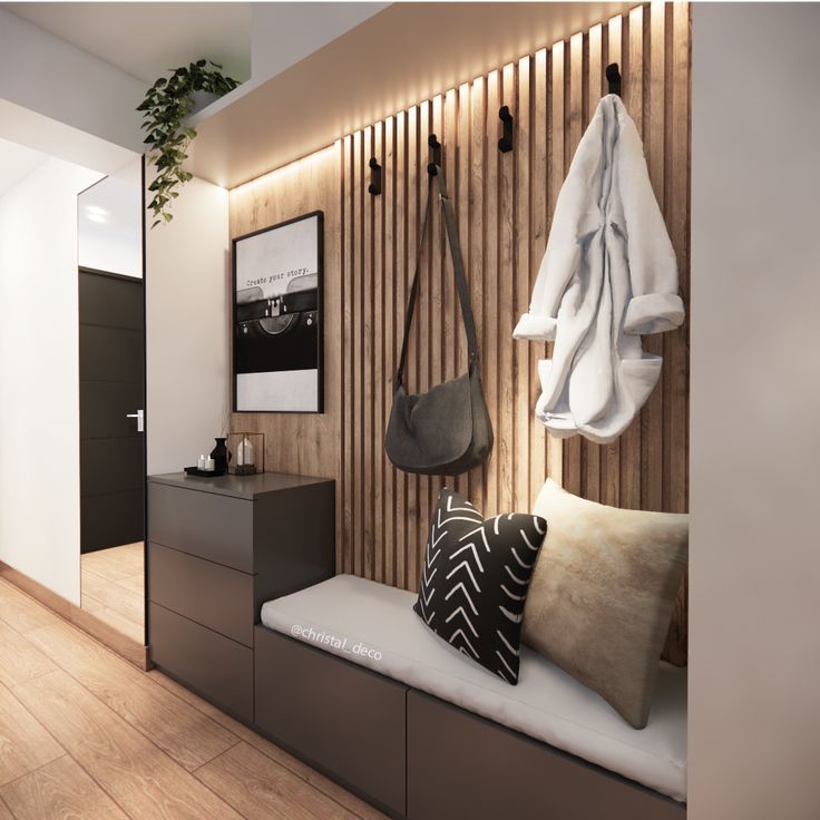 an entryway with wooden paneling and hanging items on the wall, along with a bench