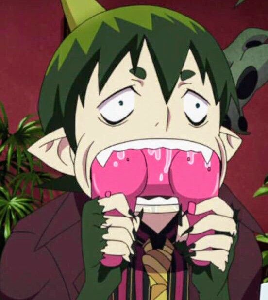 an anime character with green hair holding pink lollipops in front of his face