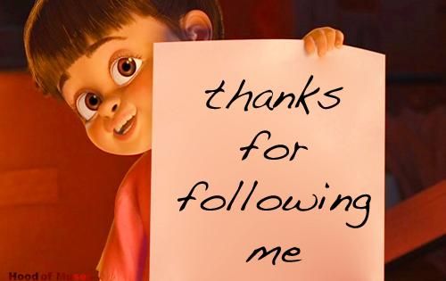 a child holding a sign that says thanks for following me