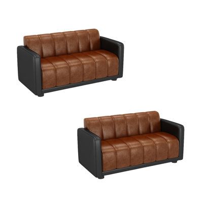 two brown leather couches sitting next to each other