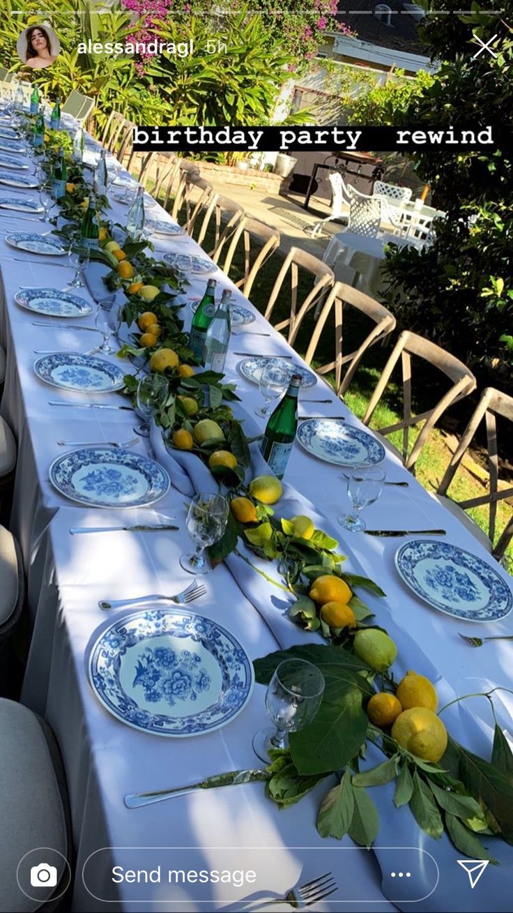 a long table with plates and lemons on it is set up for a birthday party