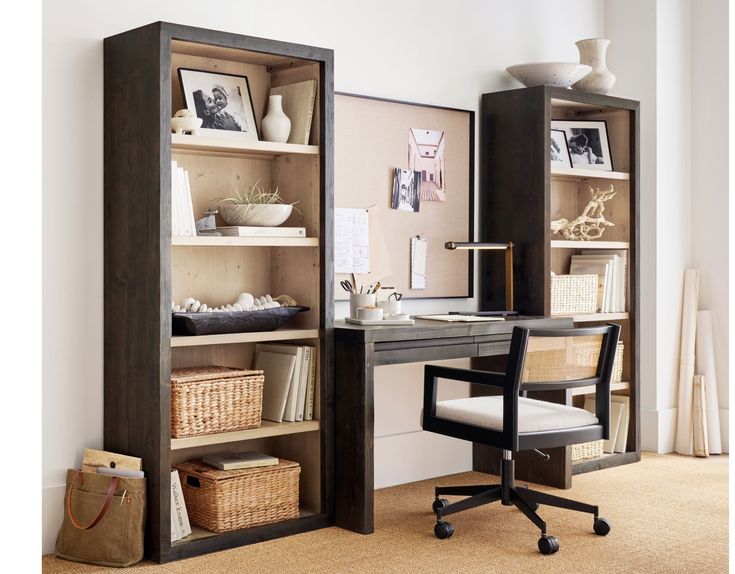 a home office with an open bookcase and desk