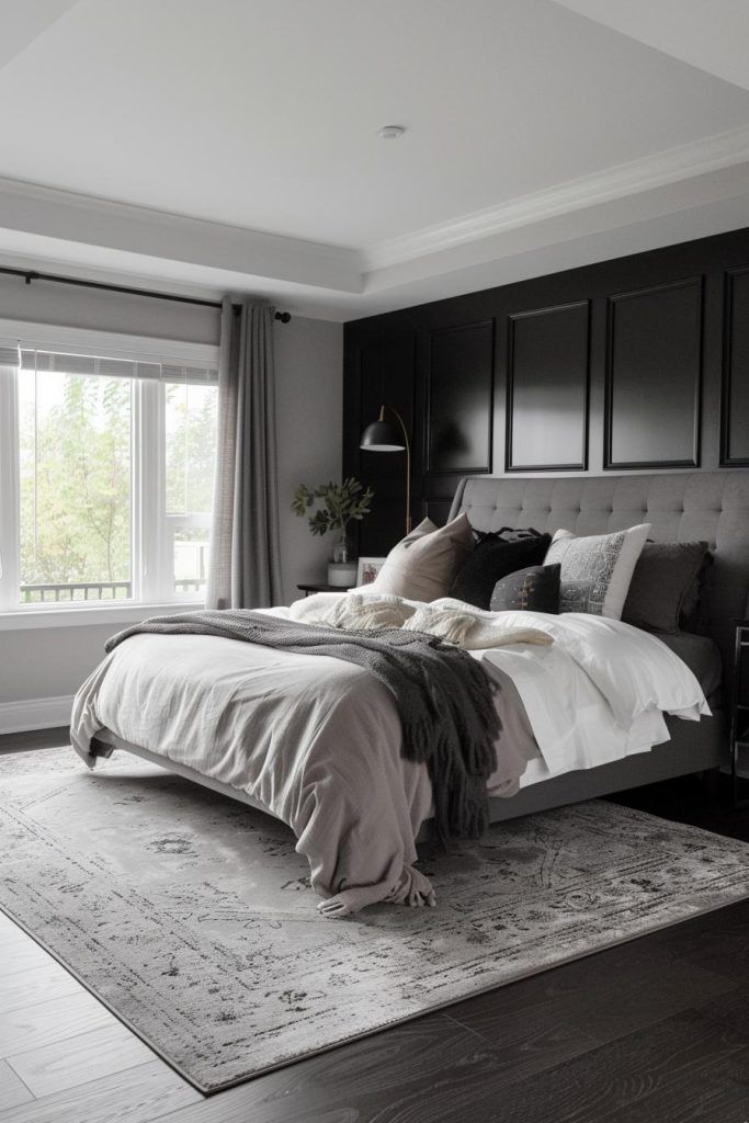 a large bed sitting in the middle of a bedroom next to a window with curtains