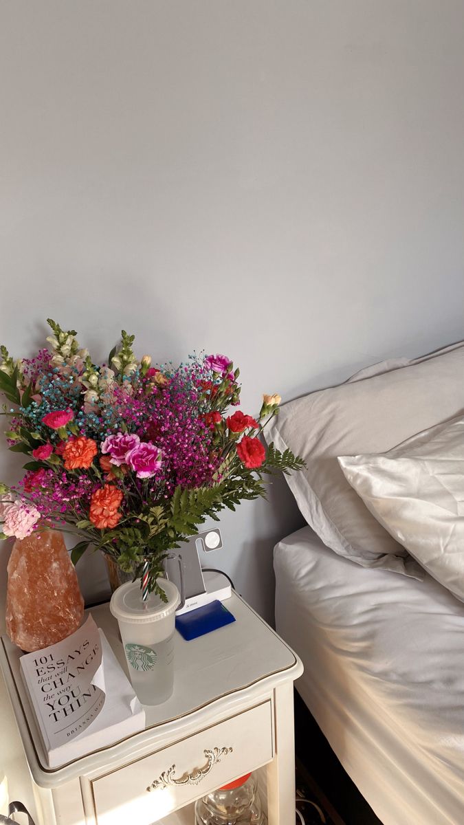 Carnations & Lilly’s. 101 essays that will change the way you think. Salt lamp Bedside Flowers Aesthetic, Flowers On Nightstand Aesthetic, Flowers On Bedside Table, Flowers On Nightstand, Flowers Nightstand, Nightstand Flowers, Windowsill Nightstand, Bedside Flowers, Nightside Table