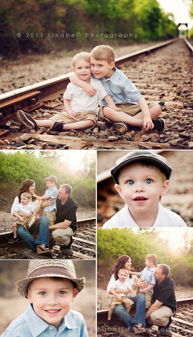 a family sitting on train tracks together