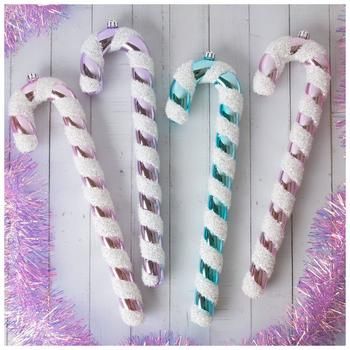 three candy canes are sitting next to each other