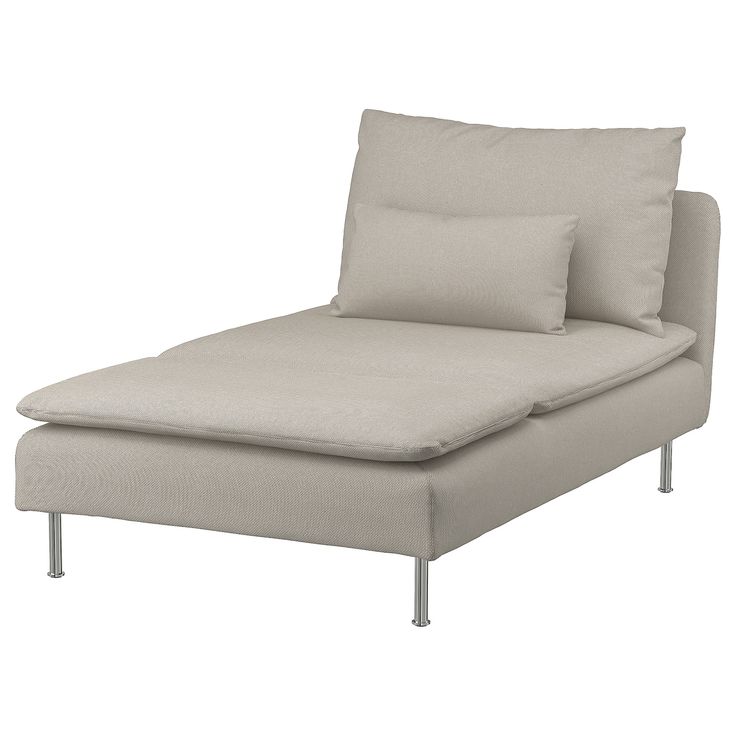 a white couch with pillows on top of it