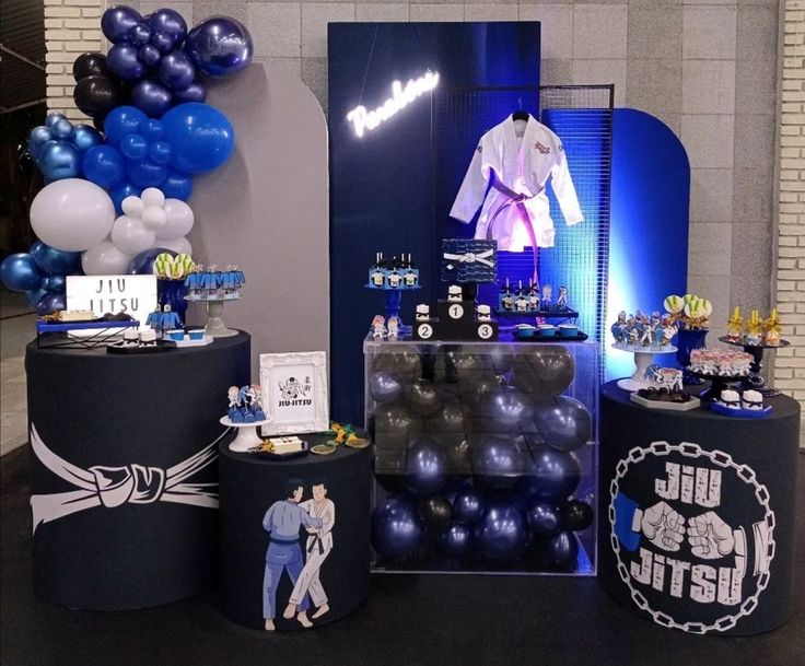 a display with balloons, shirts and other items