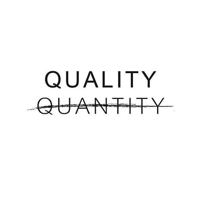 the words quality and quantity are written in black ink