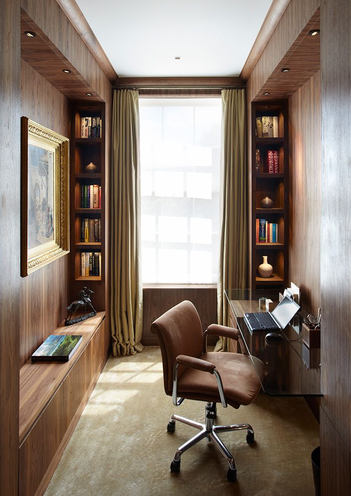 a living room filled with furniture and bookshelves