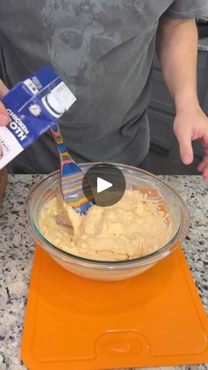 a person is mixing something in a bowl