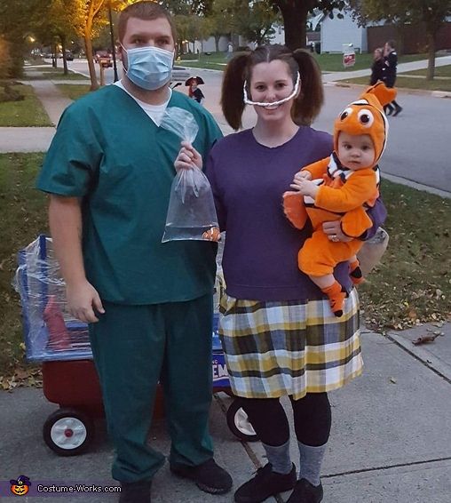 a man and woman are dressed up as winnie the pooh and tigger costume