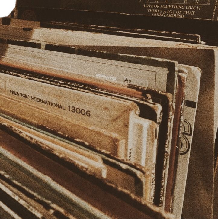 there are many old records stacked on top of each other in this pile and one is empty